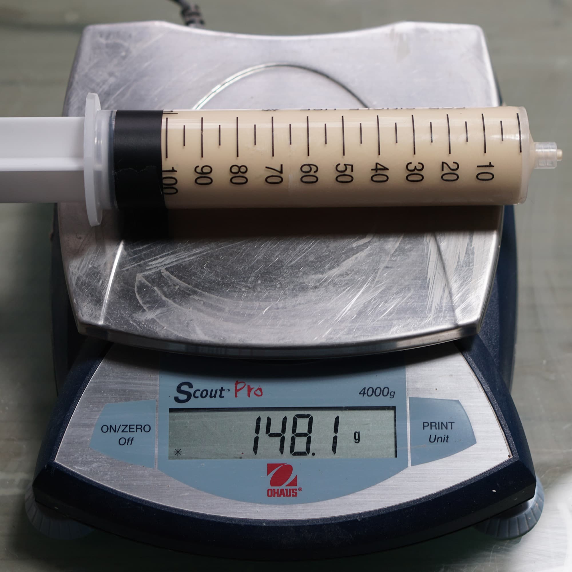 Filled syringe on scale