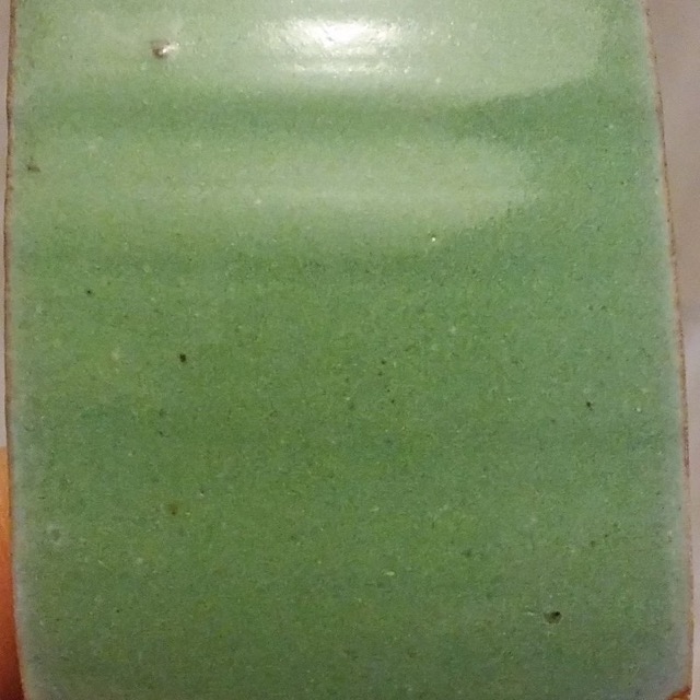 Green titanium glaze